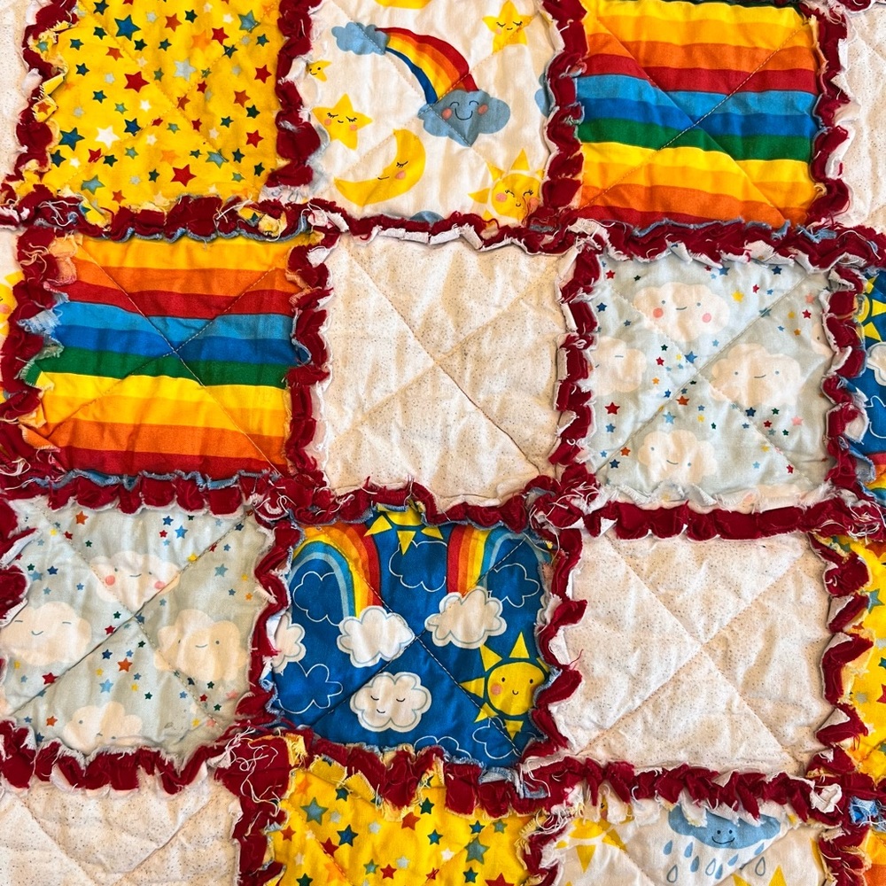 Handmade rainbow crib quilt